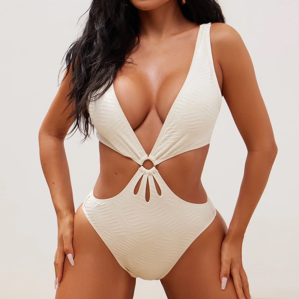 New with tag. Cream one piece swimsuit size Small